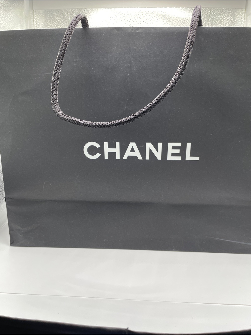 CHANEL Black Paper Shopping Bag with Rope Handles and White Logo